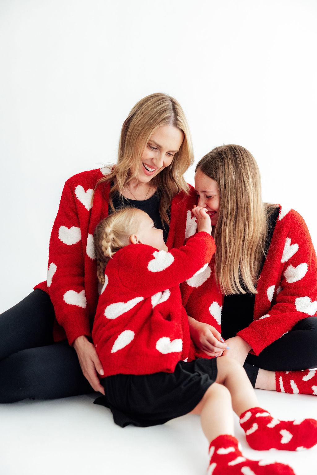 The Mila and Rose founder with her two daughters in Mila and Rose twirl dresses and sweaters