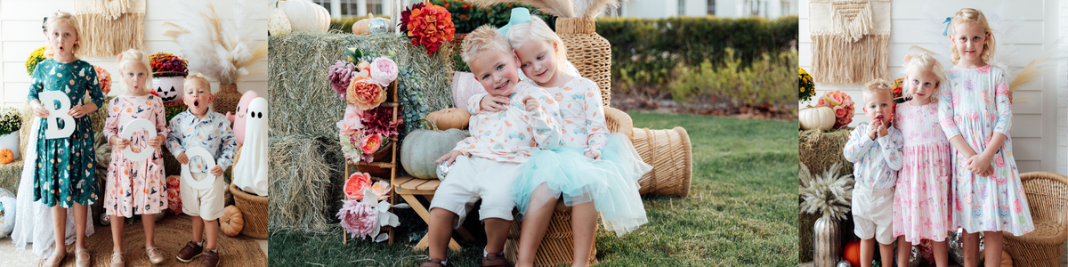 Children wearing matching pastel outfits featuring a playful party dog print with polka dots.