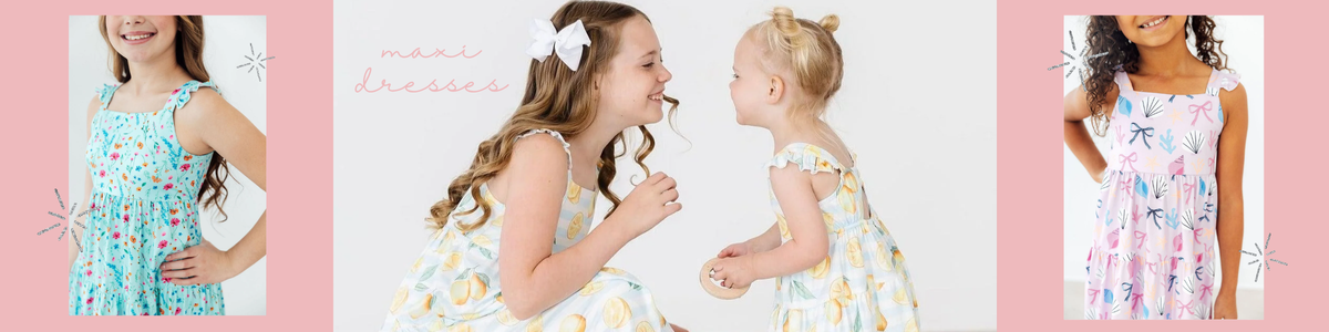 Girls wearing colorful, sleeveless tiered maxi dresses with floral, lemon, and seashell prints.