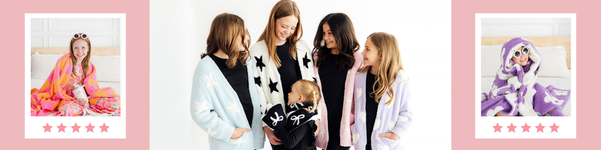 Group of girls wearing soft, plush star-patterned cardigans and cozy loungewear in pastel colors.