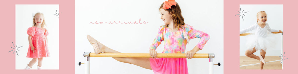 Three young girls modeling stylish dancewear and sparkly party dresses against a soft pink background.