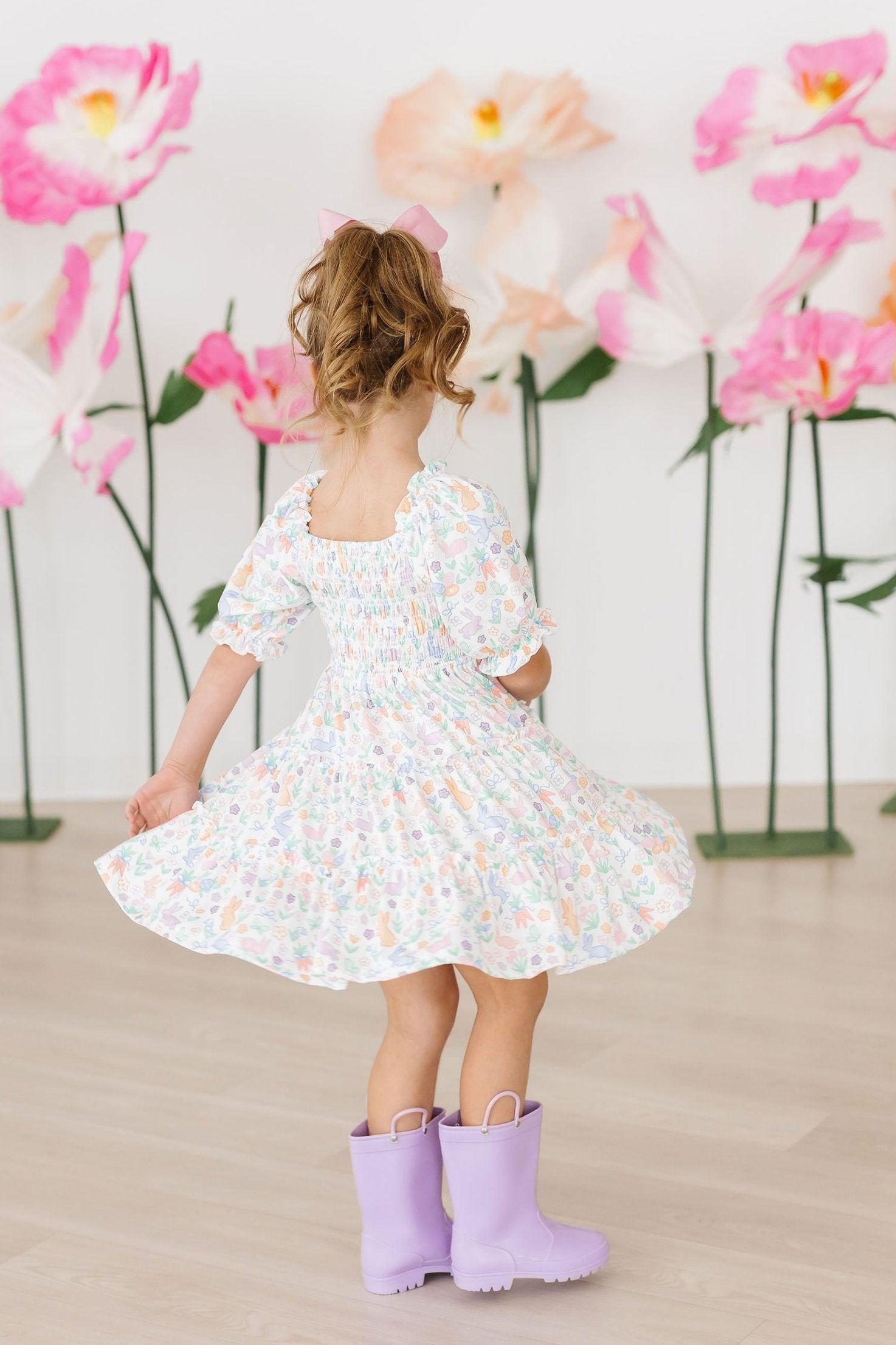 smocked ruffle dress Black Long Sleeve Mini Style it up or downpair with heels for formal occasions or sandals and a denim jacket for daytime outings Girls' Hoppy Easter Smocked Ruffle