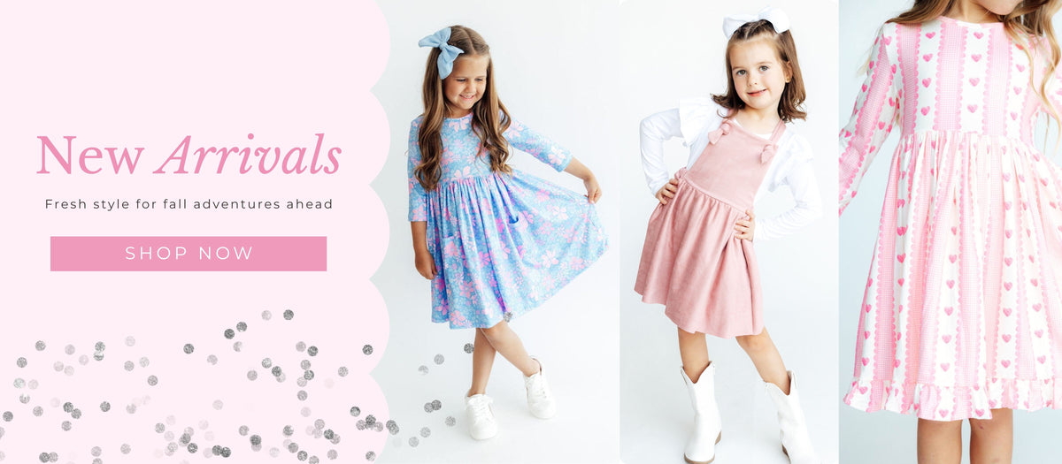 Girls wearing Mila & Rose fall dresses in colorful seasonal prints. Shop new arrivals.