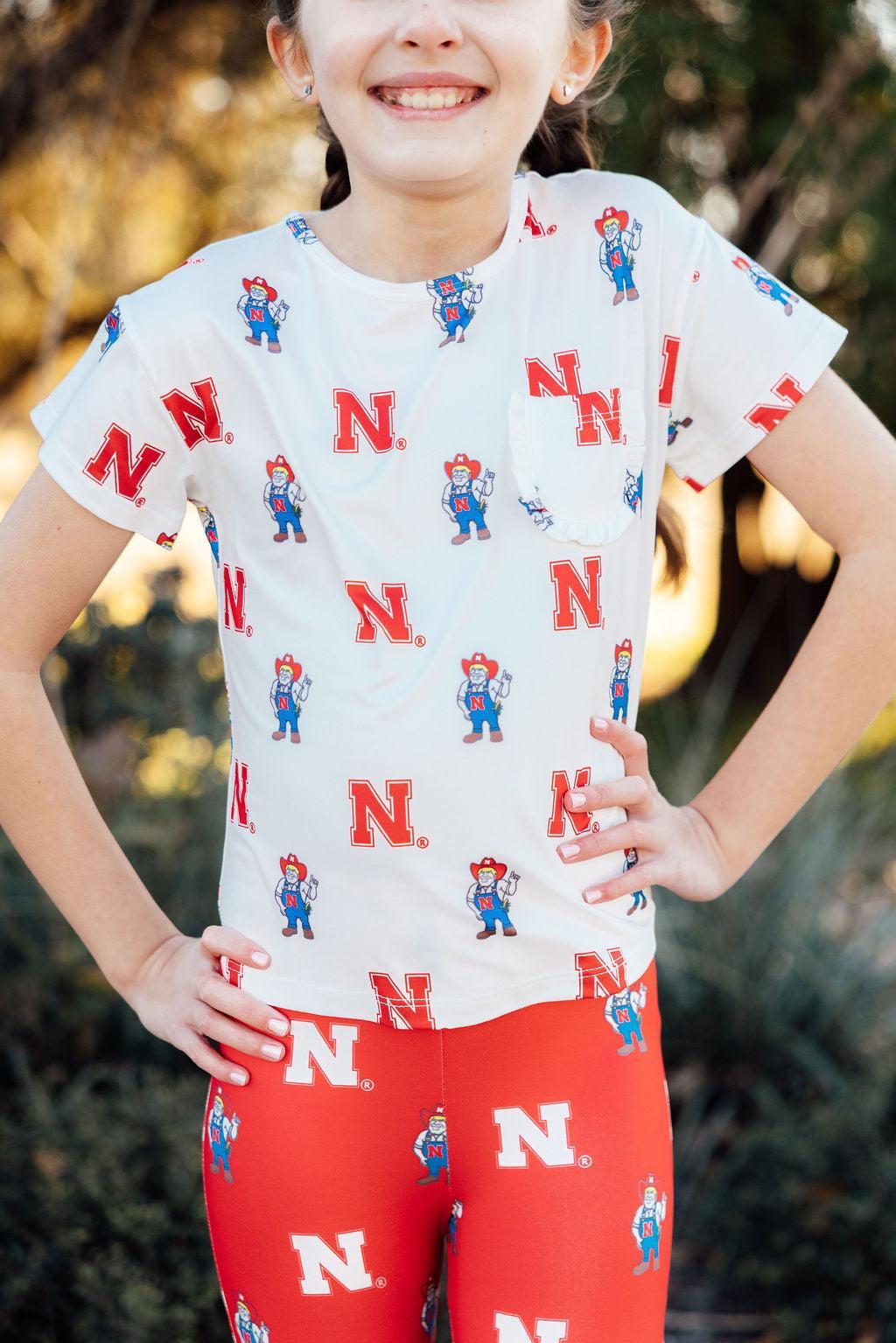 (S) Nebraska White Herbie Husker Ruffle Pocket Tee-Mila & Rose ®