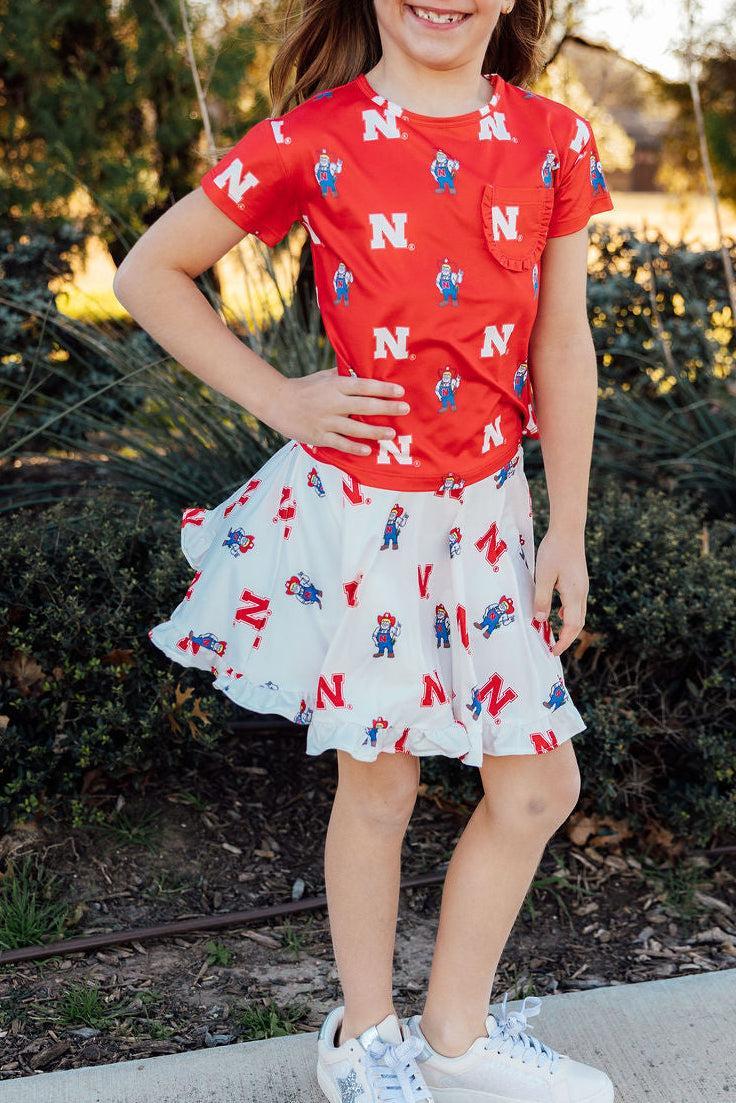 Nebraska Red Herbie Husker Ruffle Pocket Tee-Mila & Rose ®